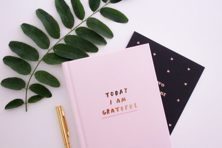 Notebook and pen for business planning and entrepreneurship tips.