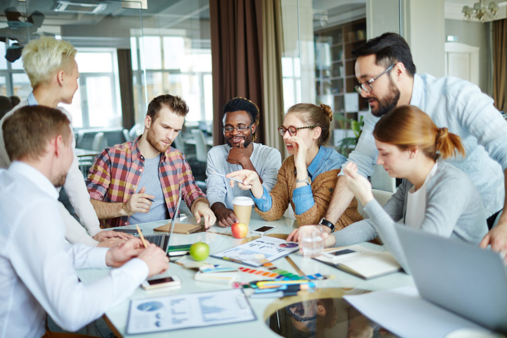 a group of people sitting around a table