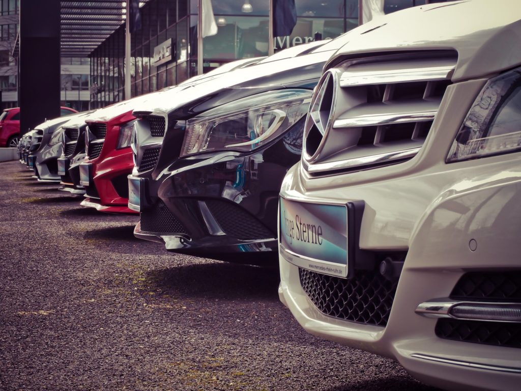 a row of cars in a parking lot