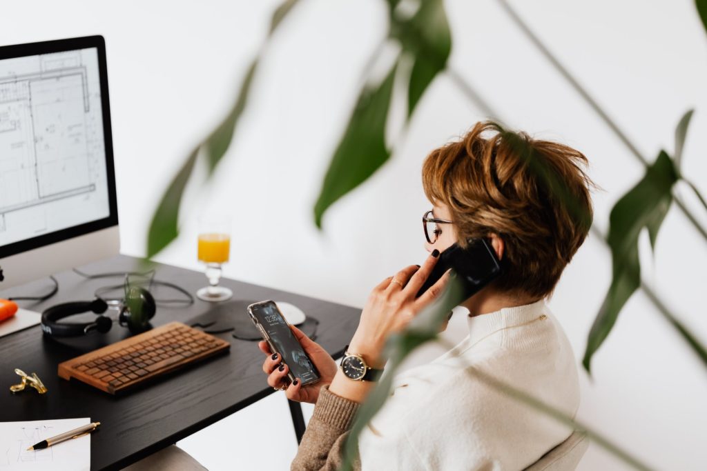 a person wearing a headset and holding a tablet