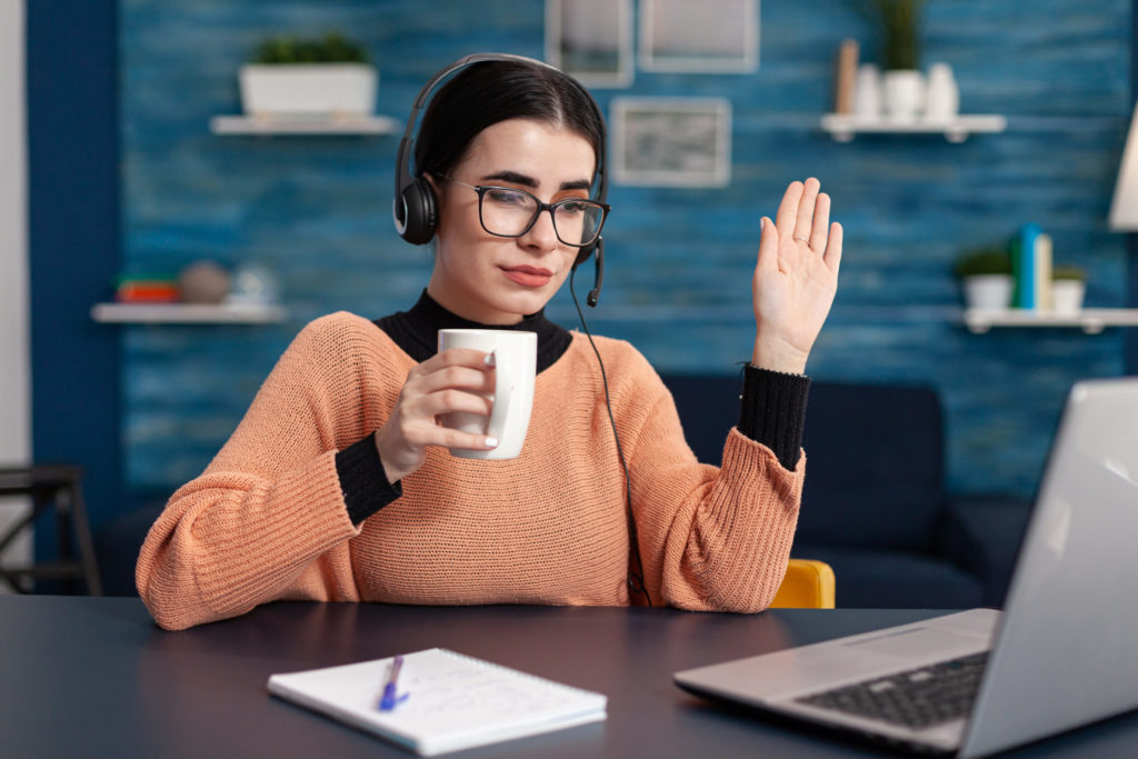 a person holding a cup of coffee