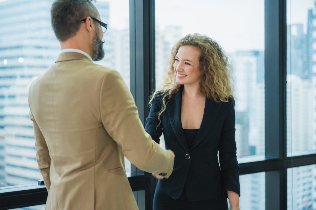 a man and a woman shaking hands